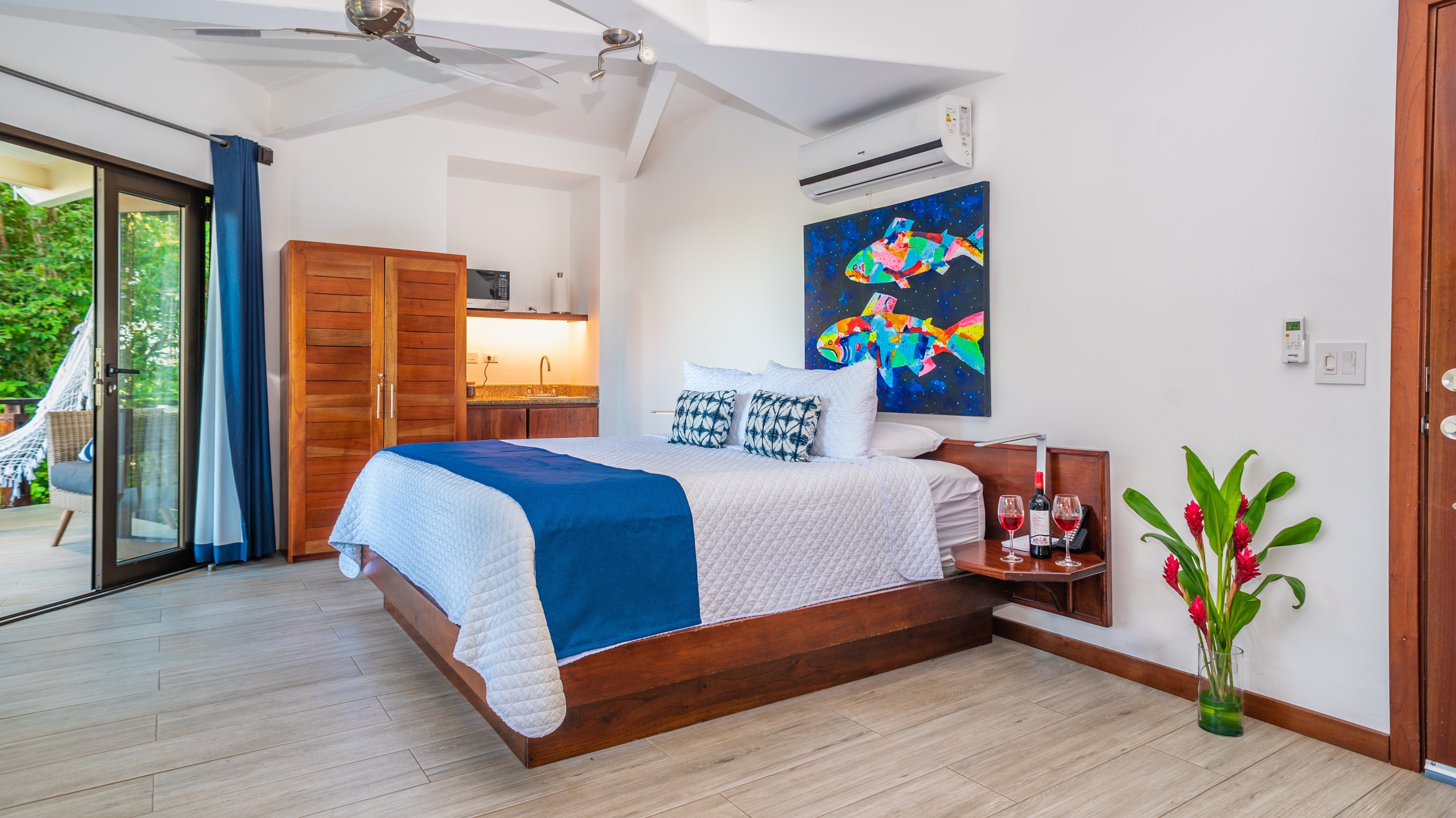 King bed, closet, and wet bar