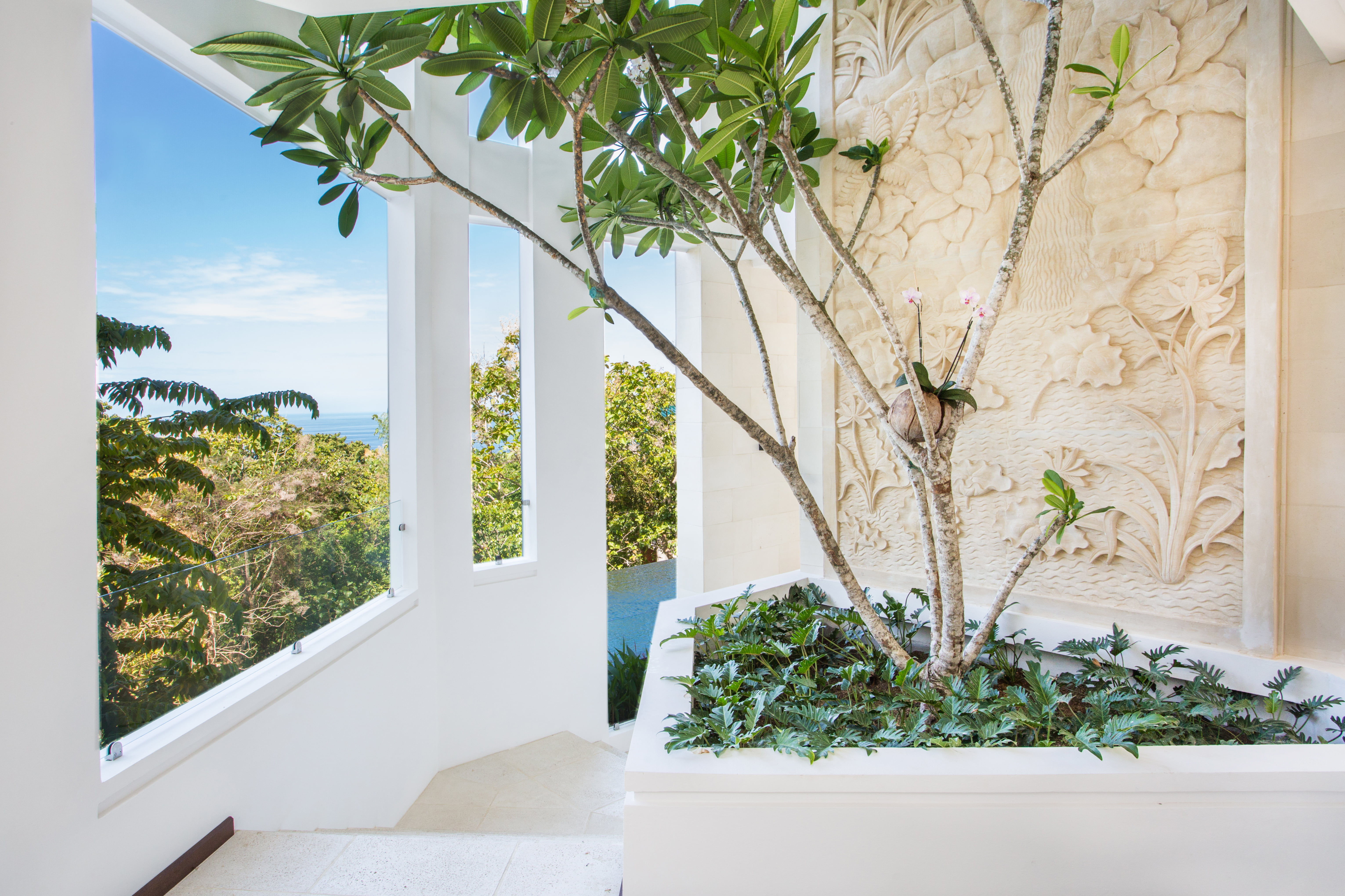 3rd floor - 3rd floor landing with frangipani tree and limestone carving