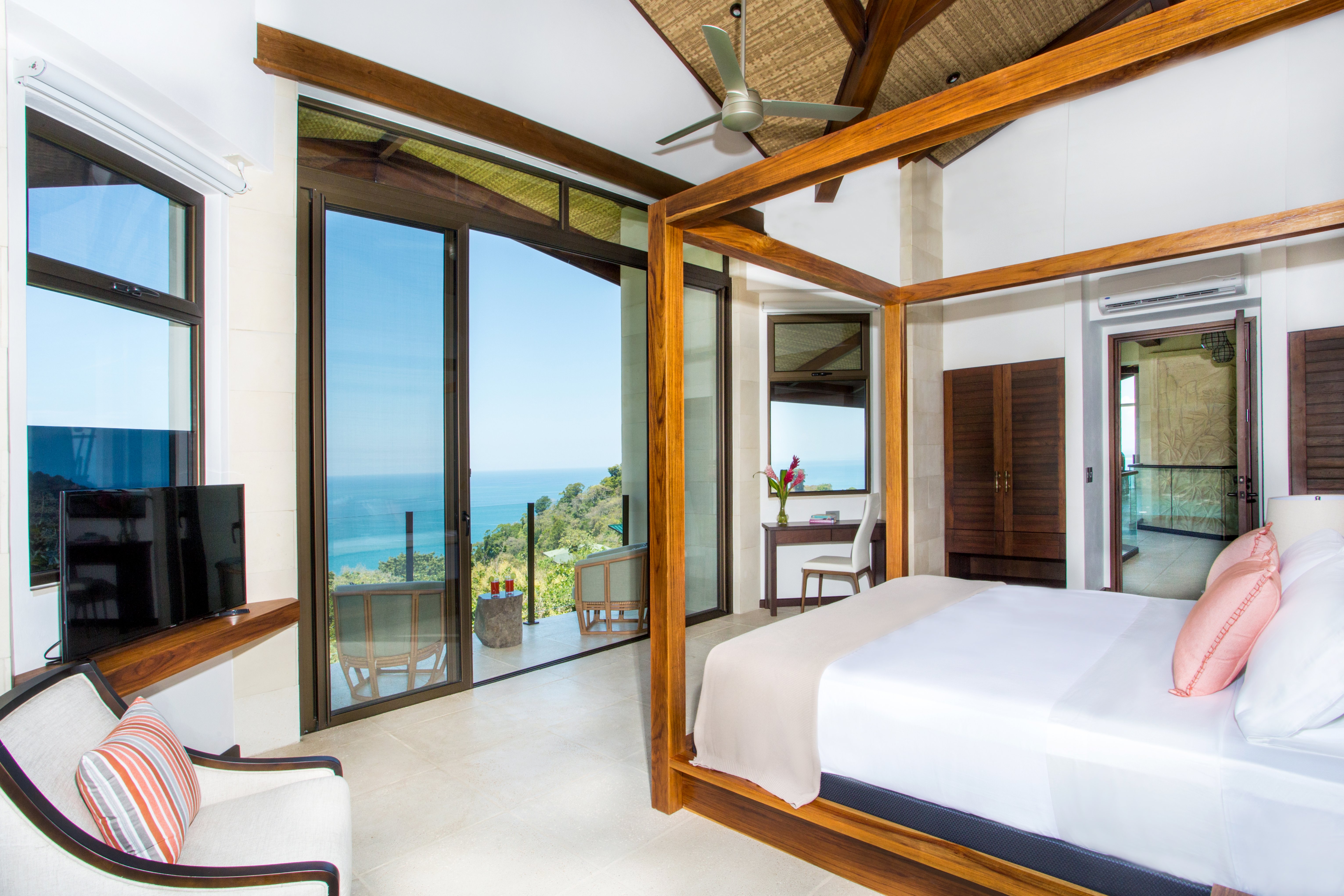 Primary bedroom, 5th floor, with vaulted ceilings and private balcony