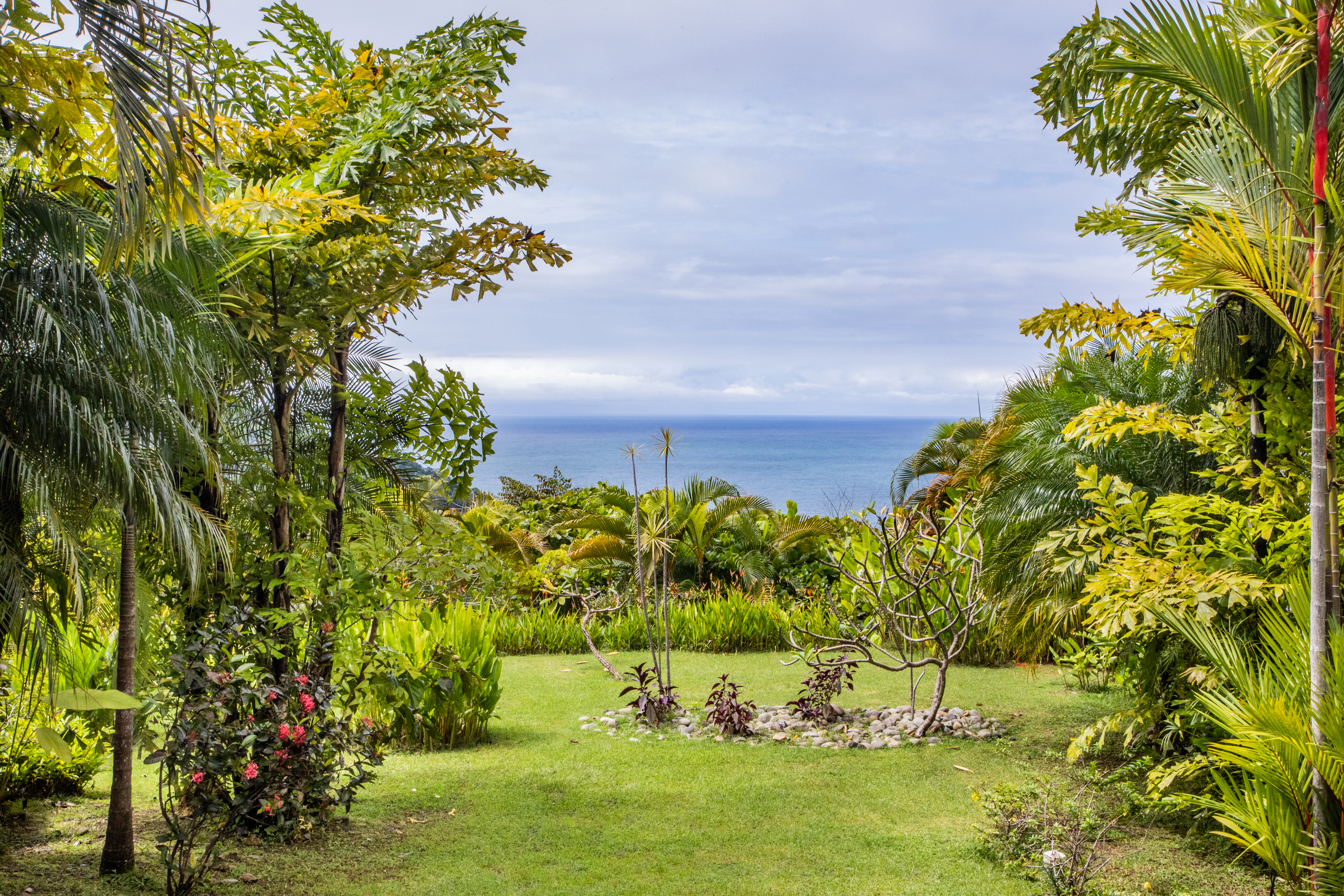The lawn area provides green space between the villas