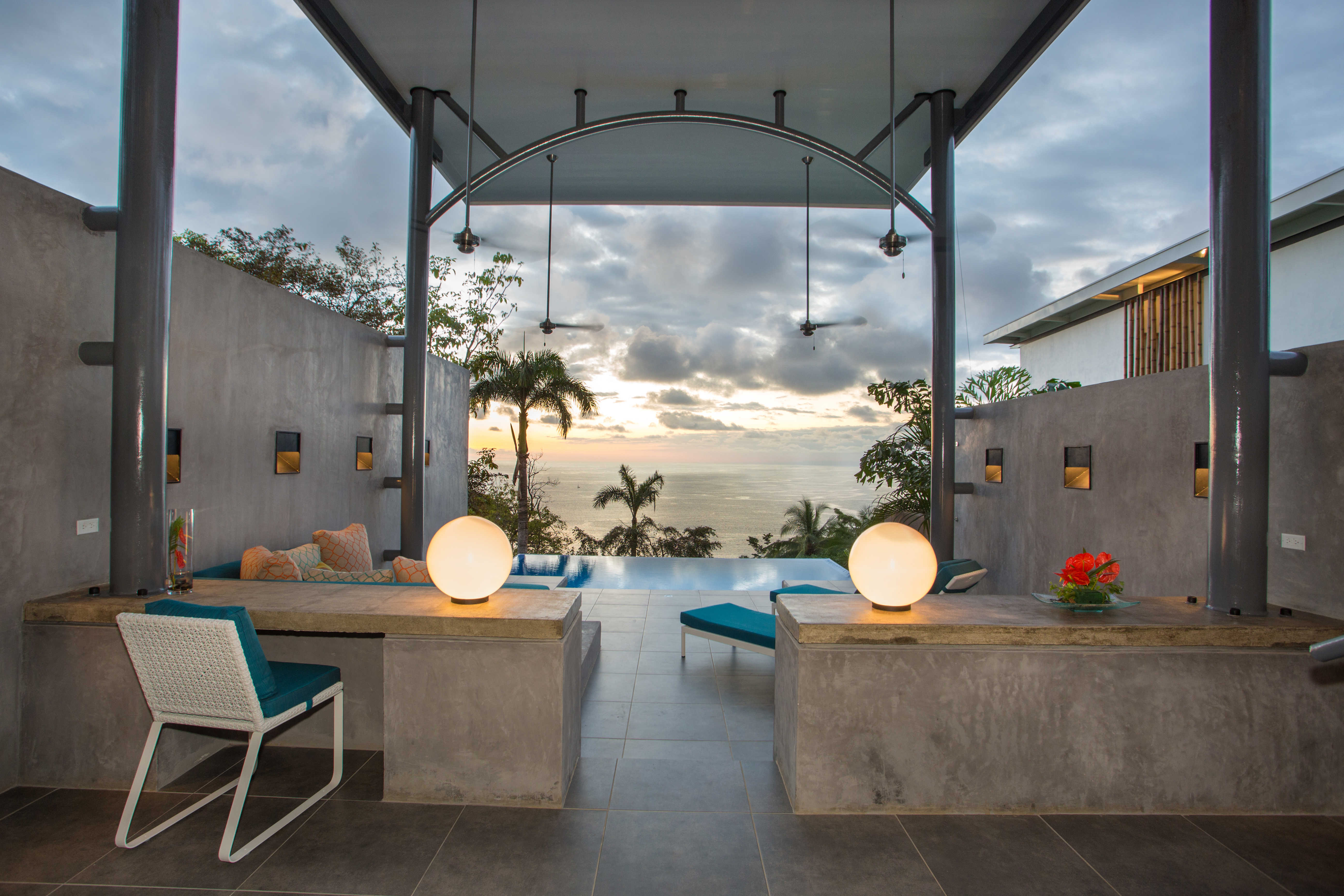 The indoor/outdoor living room, deck, and pool